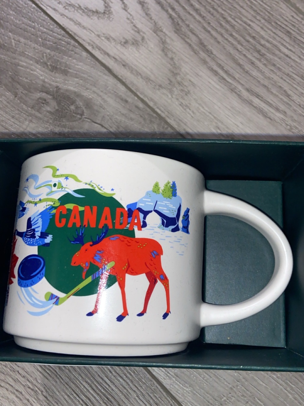 Starbucks White Mug with Red Moose and Blue-Green Artwork